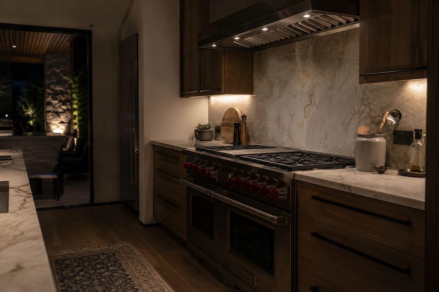a moody, dark luxury kitchen with a Wolf range